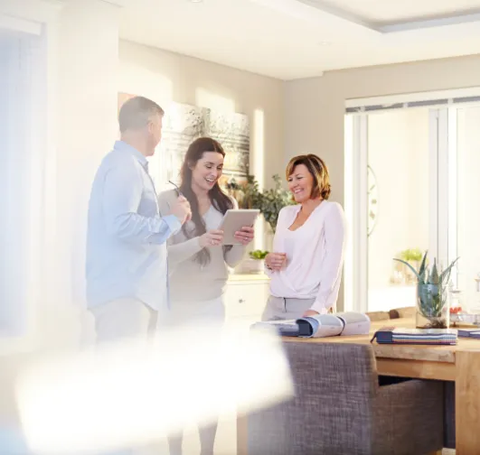 Dallas interior design project manager reviewing design plans with clients during a consultation